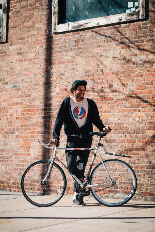 rides a Fuji CLassioc fixed gear bike  photographed at Greenpoint Ave. and Franklin St., Brooklyn  going for a slice of pizza on the way to practice with his band, Los Finks