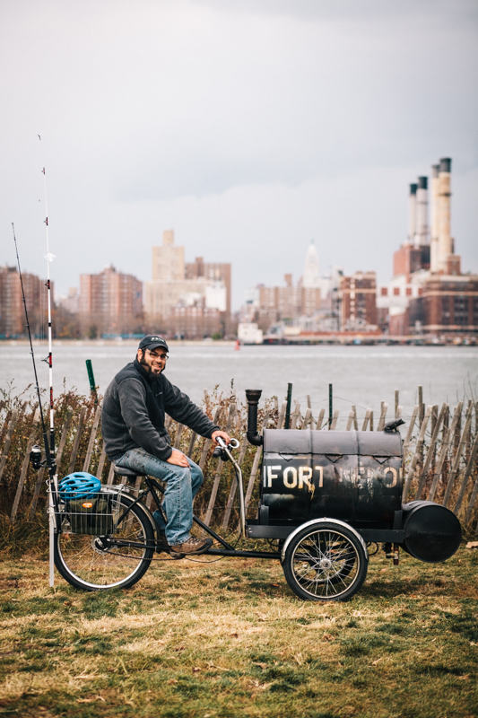 rides a Workman Cycles custom welded former ice cream delivery bike photographed at East River Park, Brooklyn  en route to the Brooklyn Fishing Derby 