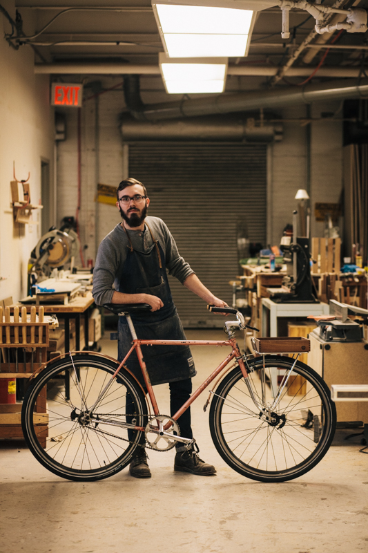 rides a Surly Cross-Check bicycle  photographed at 30th St. and 47th Ave., Queens working at the Surname Goods shop 