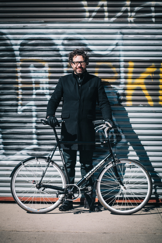 rides a rebuilt Cannondale R500  single-speed  going home from Red Hook  photographed at Willoughby St. and Nostrand Ave., Brooklyn