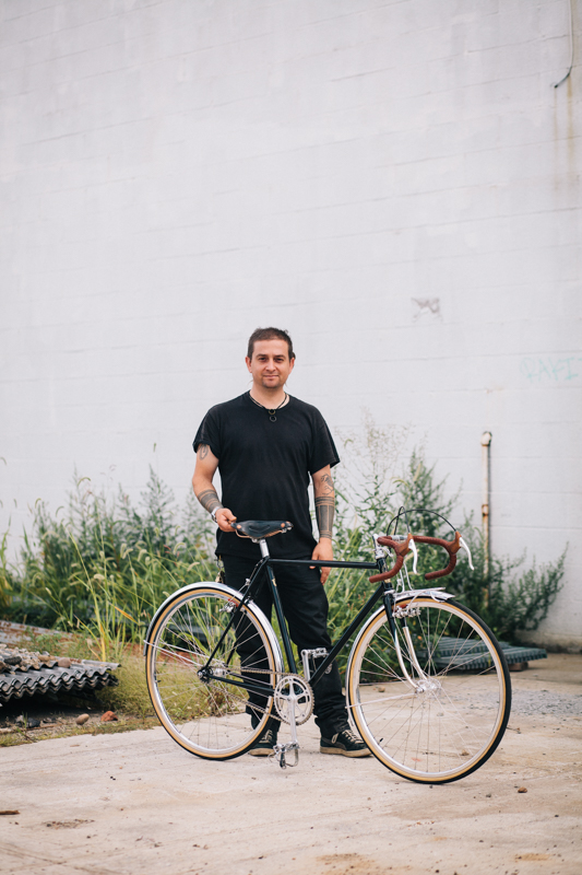 Johnny  with a Coast Cycles fixed gear bike  photographed at the Knockdown Center in Maspeth, Queens  while exhibiting at the Bike Cult Hand-Built Bike Show  