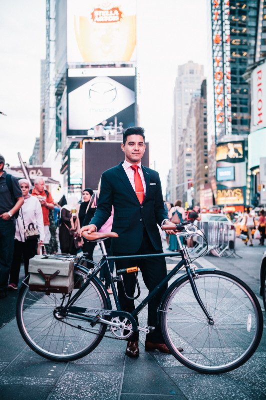 rides a WIndsor Oxford 3-speed bike  photographed at Times Square  going home from work