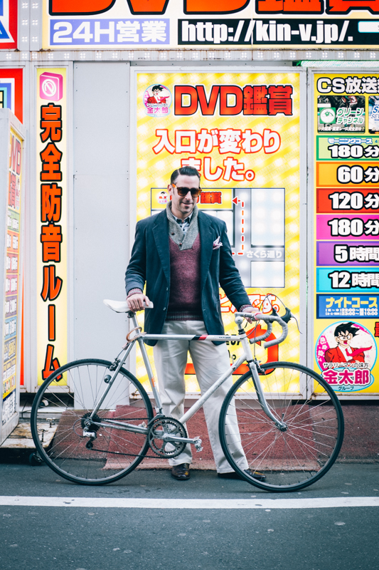 rides a Bridgestone 10-speed bicycle in Tokyo