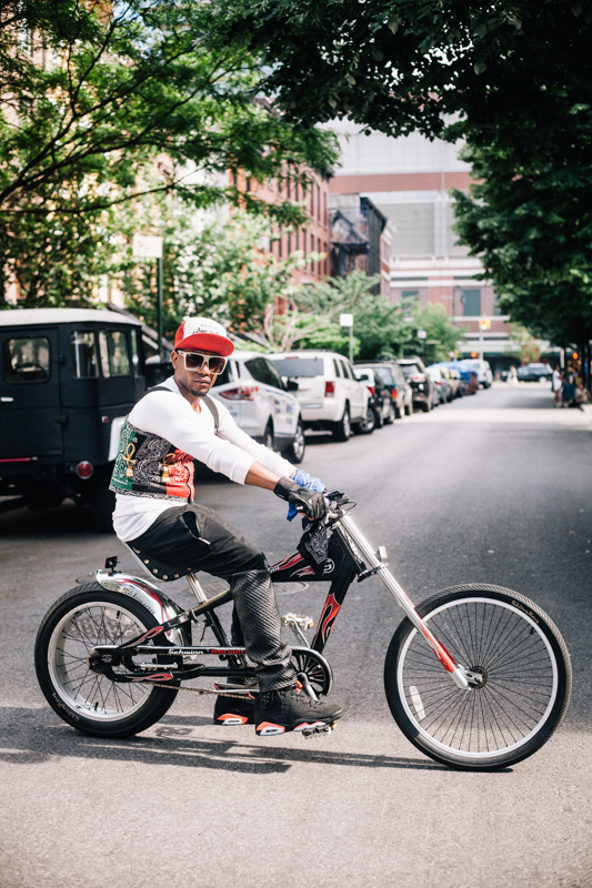 rides a Schwinn Stingray Chopper  photographed at St. Felix St. and Lafayette Ave., Brooklyn  at the Dance Africa Street Festival