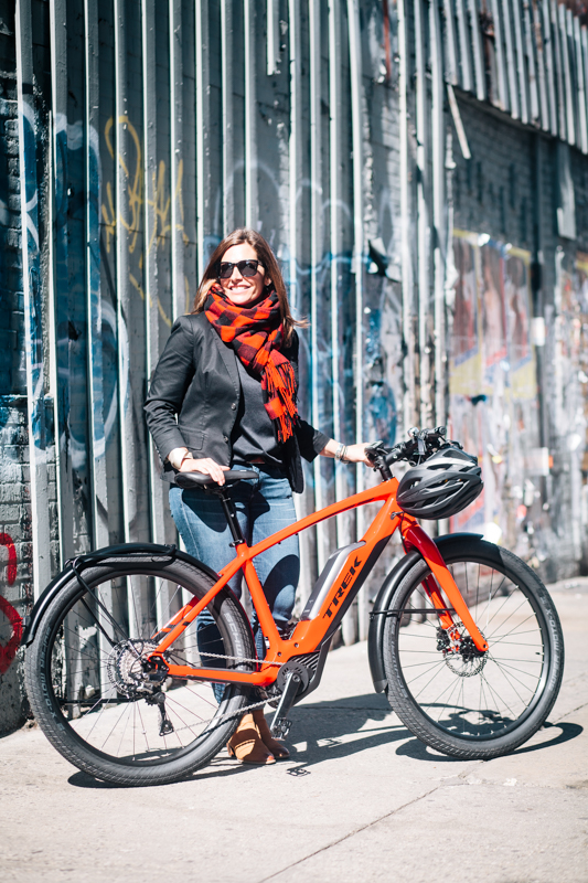 rides a Trek Super Commuter+ e-bike photographed at Rivington St. and Bowery, Manhattan during a Super Commuter+ test ride event